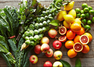 a group of fruits and vegetables on a wood surface Healthy Weight Loss Diets East Grinstead